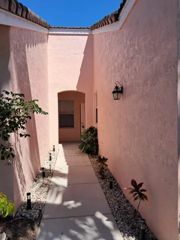 a view of a entryway with flower pots