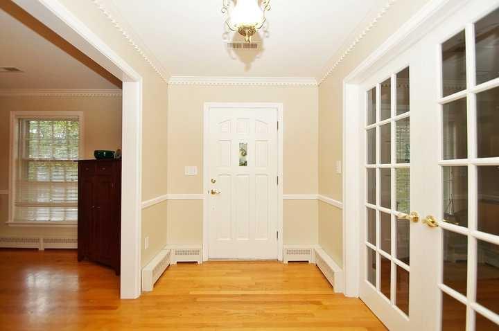 3220 Fordham Road Southwest Roanoke, VA 24014 - Photo 14 of 33 a view of an entryway with wooden floor and a livingroom
