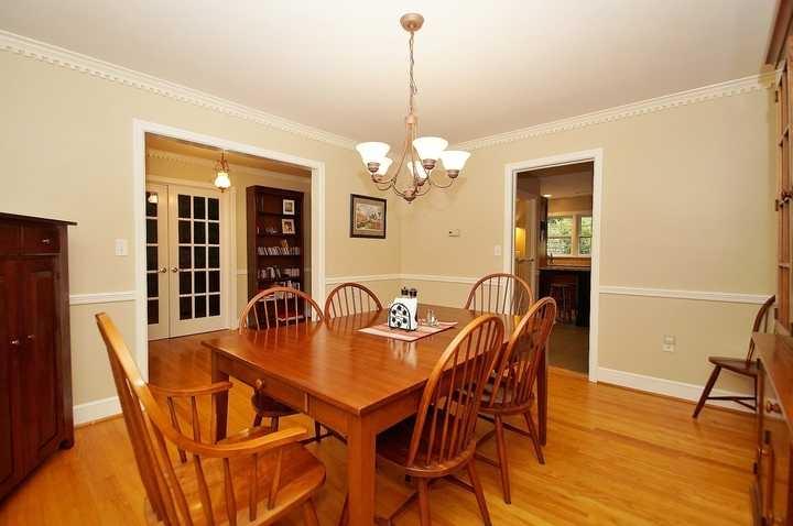 3220 Fordham Road Southwest Roanoke, VA 24014 - Photo 17 of 33 a dining room with furniture a chandelier and wooden floor
