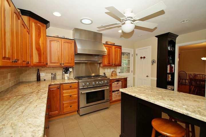 3220 Fordham Road Southwest Roanoke, VA 24014 - Photo 18 of 33 a kitchen with stainless steel appliances granite countertop a sink a stove and a refrigerator