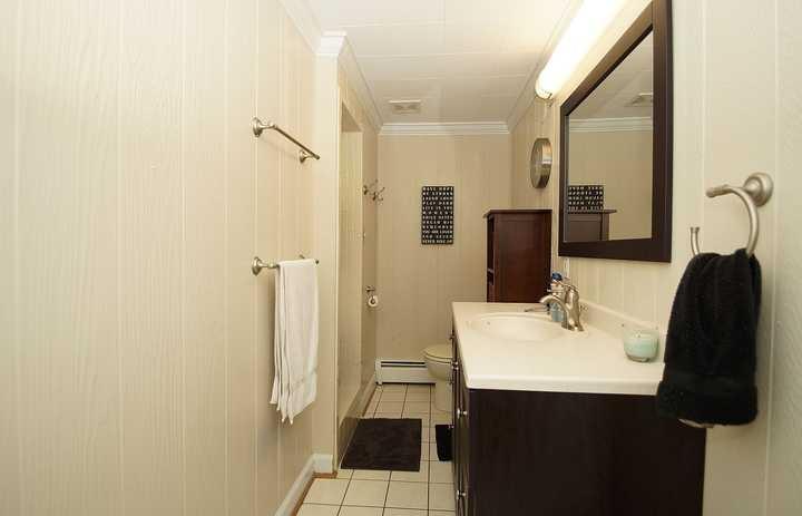 3220 Fordham Road Southwest Roanoke, VA 24014 - Photo 31 of 33 a bathroom with a sink and a mirror