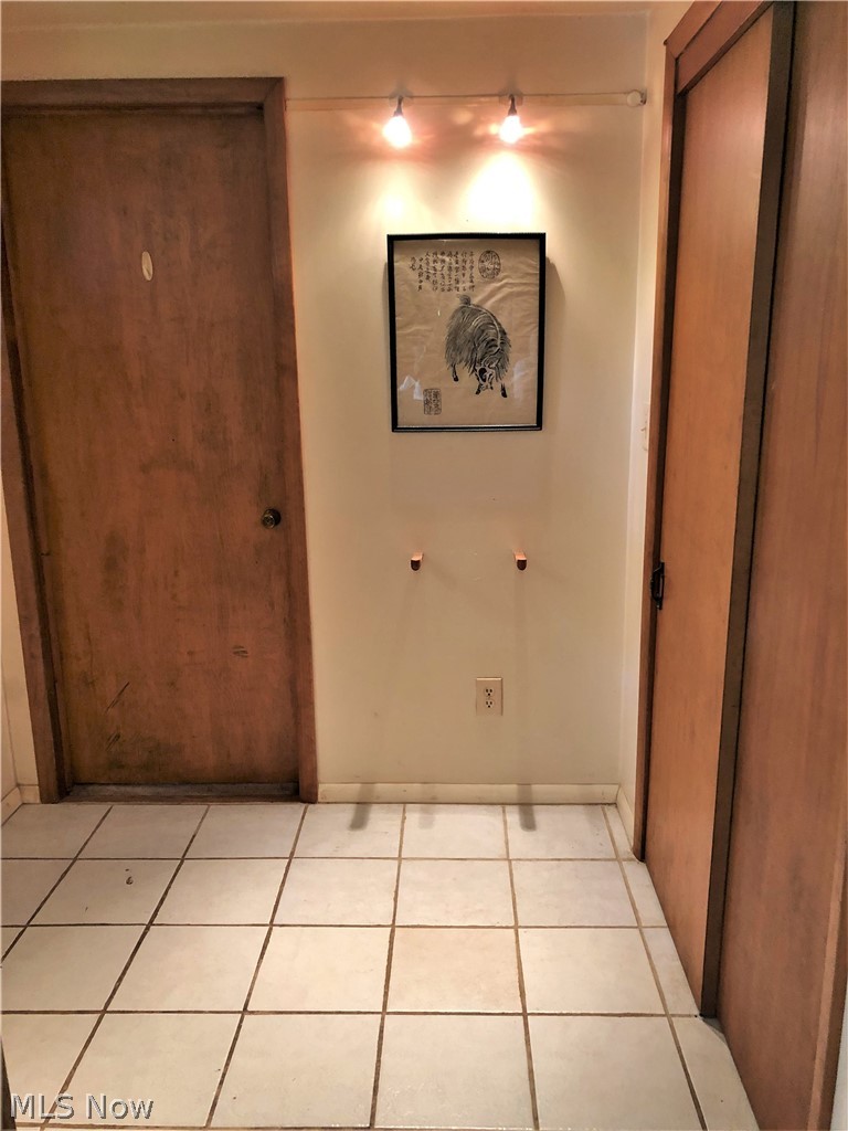 9674 Fairmount Road Novelty, OH 44072 - Photo 10 of 17 Foyer with ceramic tile floor and coat closet.
