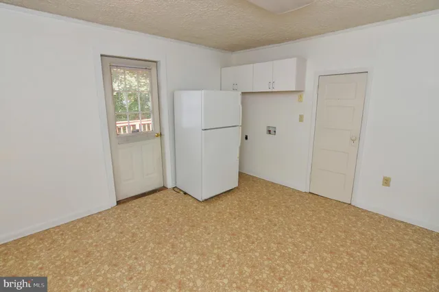 a view of kitchen with wooden floor