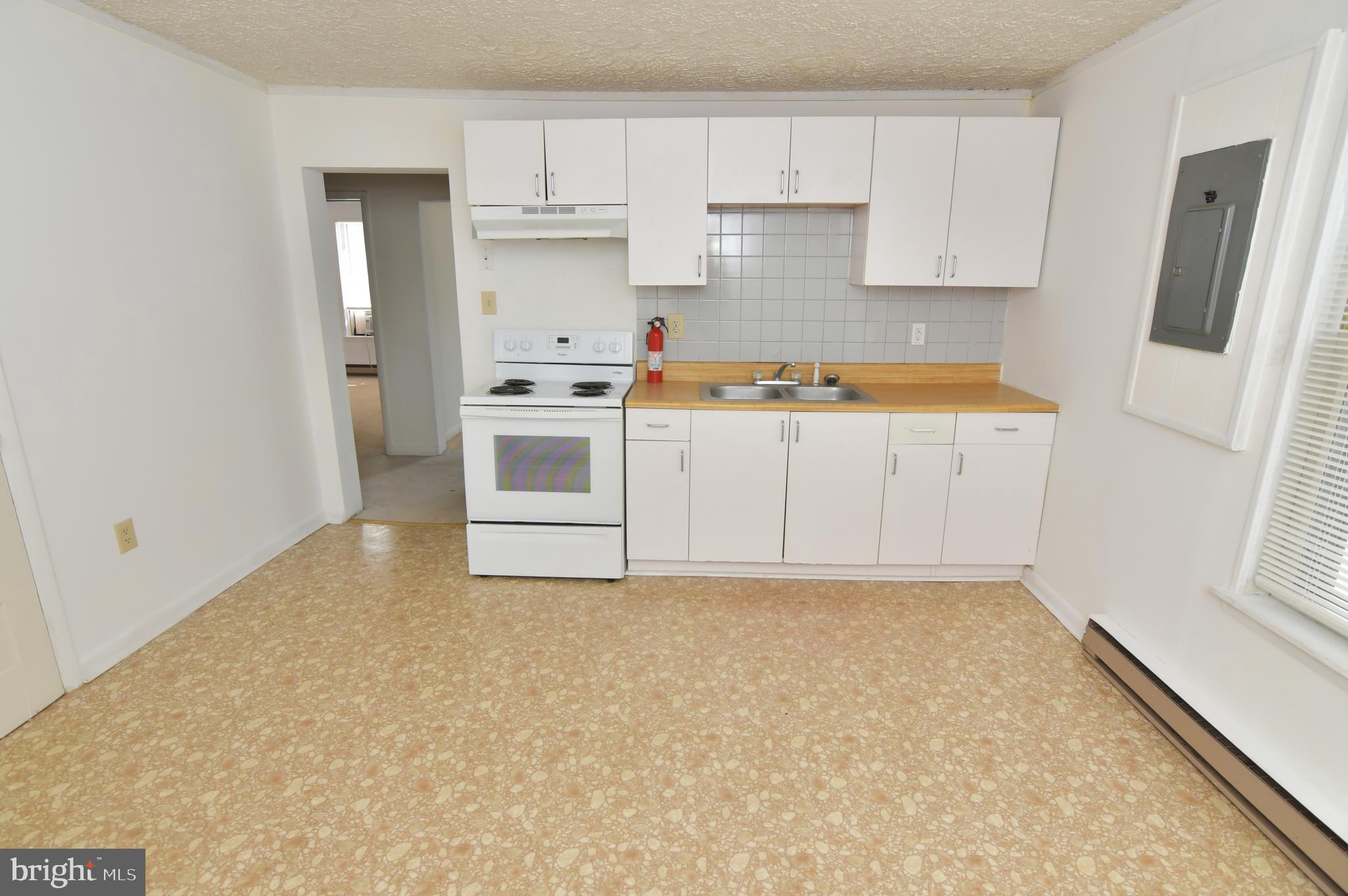 24 Jackson Avenue, Unit 2 Winchester, VA 22601 - Photo 14 of 25 a view of kitchen with wooden floor