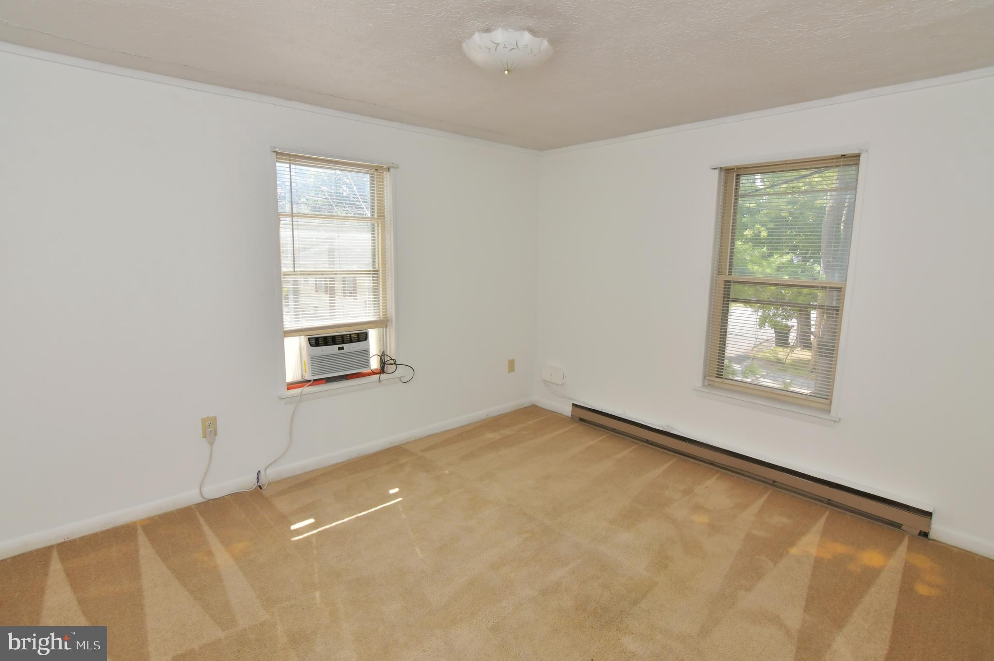 24 Jackson Avenue, Unit 2 Winchester, VA 22601 - Photo 16 of 25 an empty room with windows