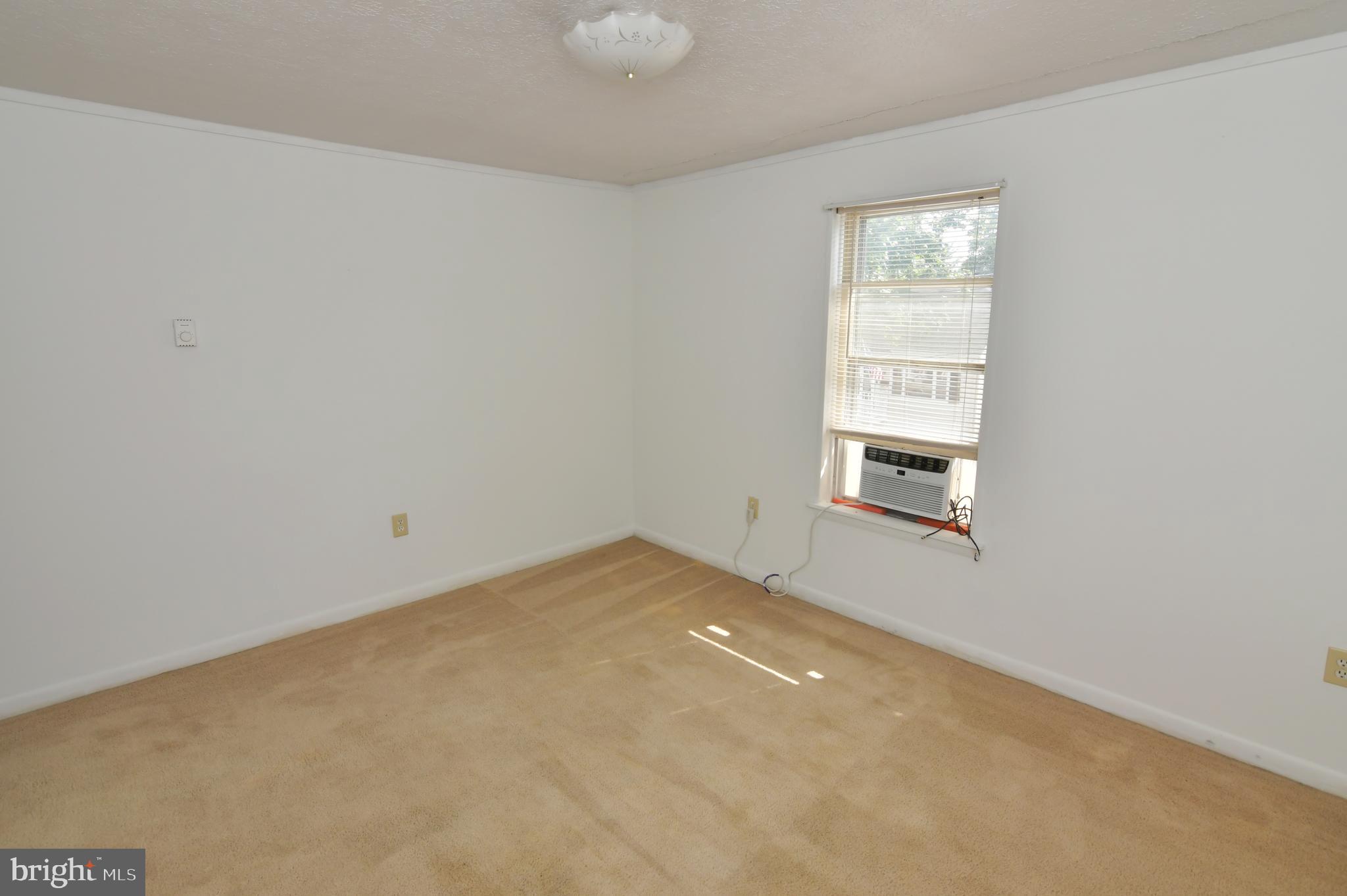 24 Jackson Avenue, Unit 2 Winchester, VA 22601 - Photo 17 of 25 an empty room with windows