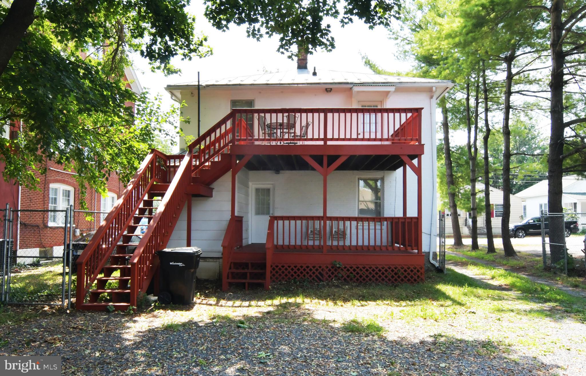24 Jackson Avenue, Unit 2 Winchester, VA 22601 - Photo 2 of 25 a view of a house with a yard balcony and wooden fence