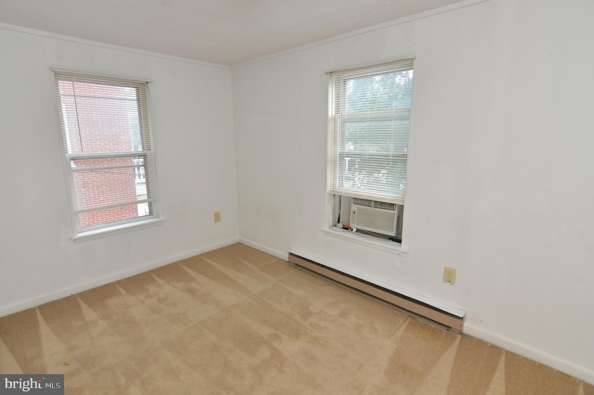 24 Jackson Avenue, Unit 2 Winchester, VA 22601 - Photo 21 of 25 an empty room with windows