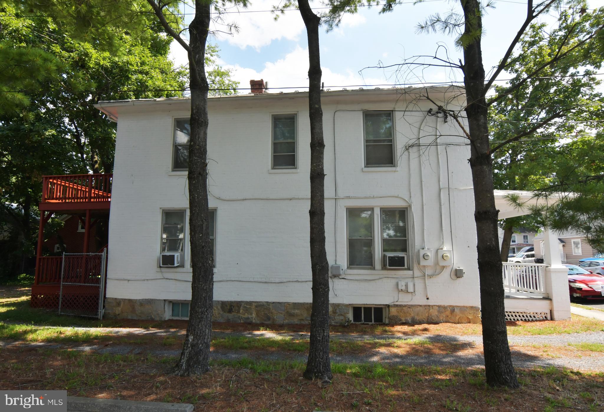 24 Jackson Avenue, Unit 2 Winchester, VA 22601 - Photo 5 of 25 a front view of a house with garden