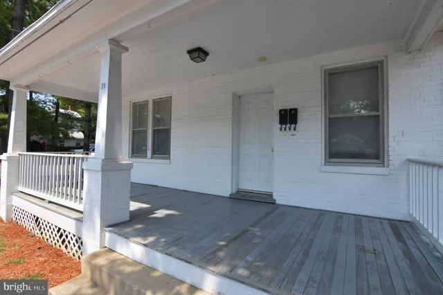 a view of a porch with wooden floor
