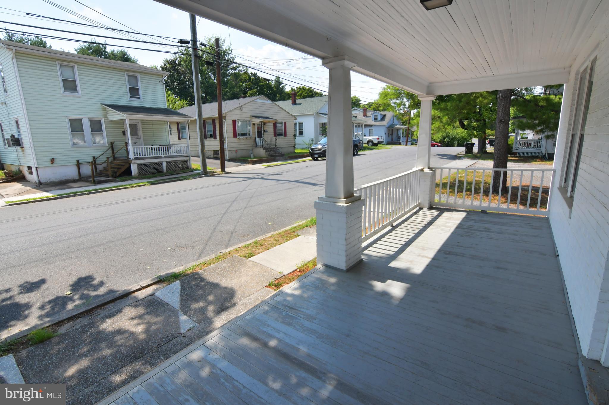 24 Jackson Avenue, Unit 2 Winchester, VA 22601 - Photo 8 of 25 a view of a porch with wooden floor