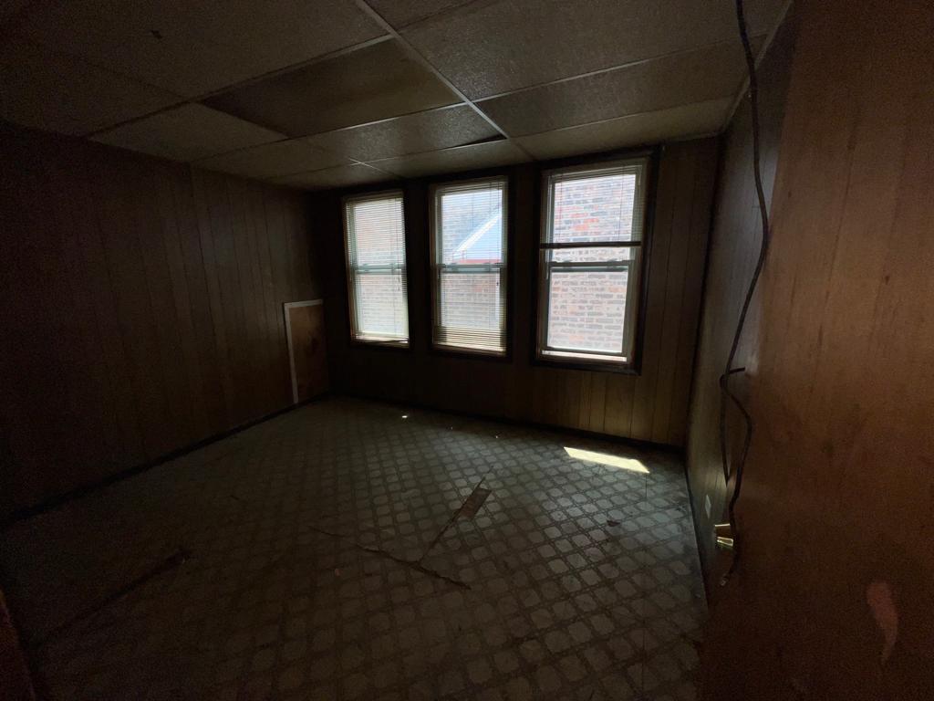 7348 South Sangamon Street Chicago, IL 60621 - Photo 12 of 29 a view of an empty room with a window
