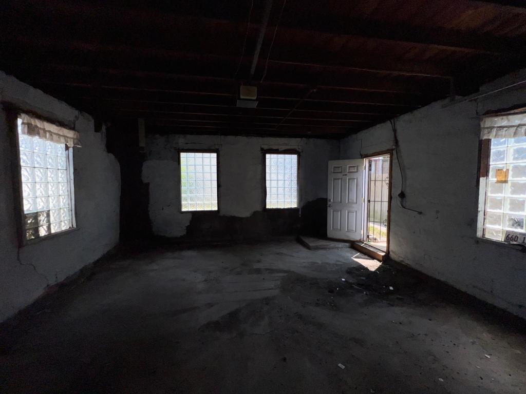 7348 South Sangamon Street Chicago, IL 60621 - Photo 20 of 29 a view of an empty room with a fireplace