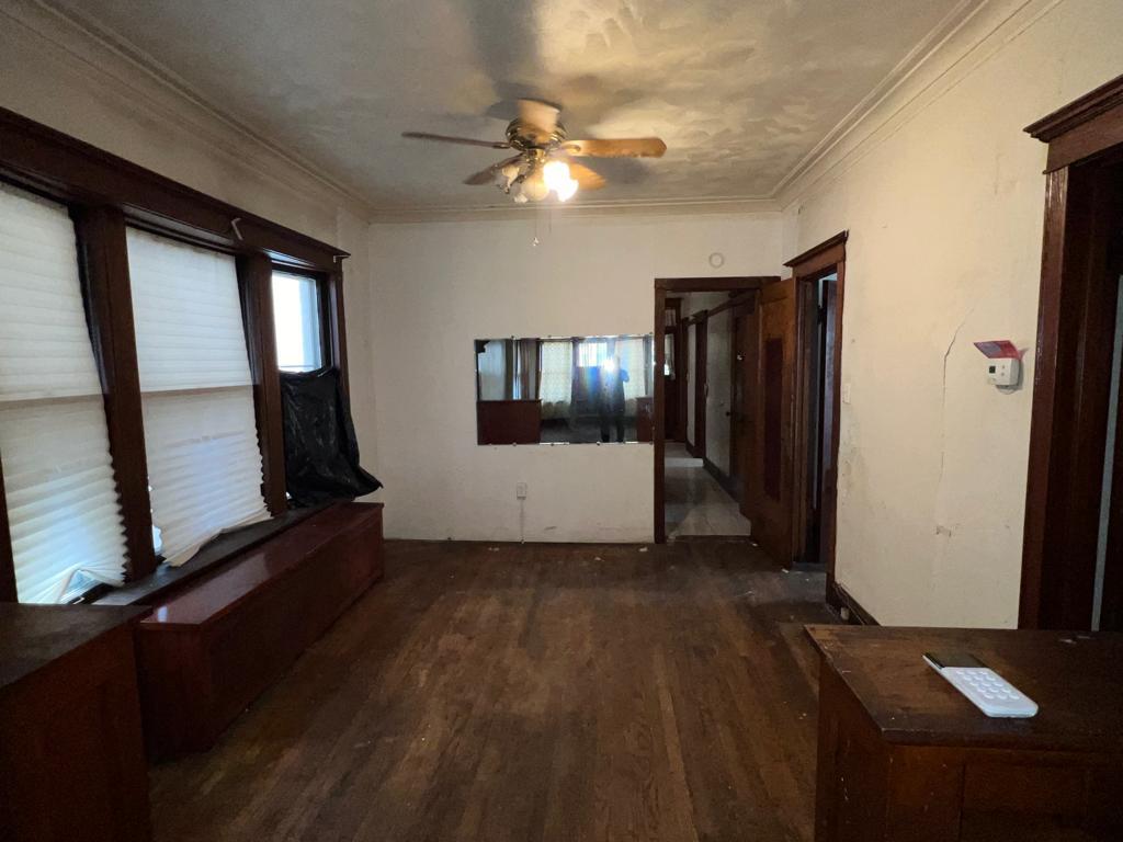 7348 South Sangamon Street Chicago, IL 60621 - Photo 5 of 29 wooden floor in an empty room with a window