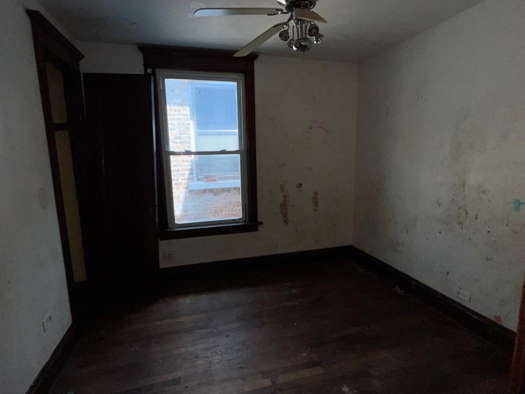 7348 South Sangamon Street Chicago, IL 60621 - Photo 8 of 29 a view of an empty room with a window