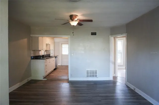 a view of a kitchen with a sink dishwasher and a refrigerator