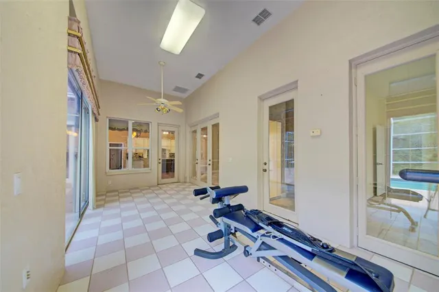 a kitchen with a stove and white cabinets