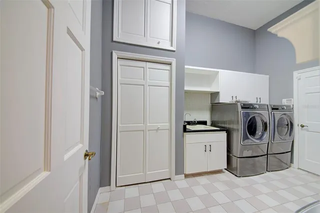 a kitchen with stove and cabinets