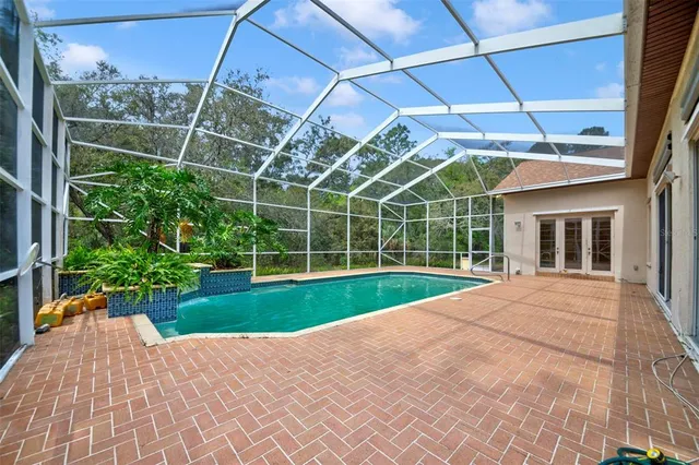 a kitchen with kitchen island a sink counter top space cabinets and stainless steel appliances