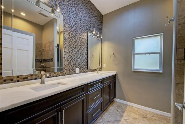 a view of an empty room with a chandelier