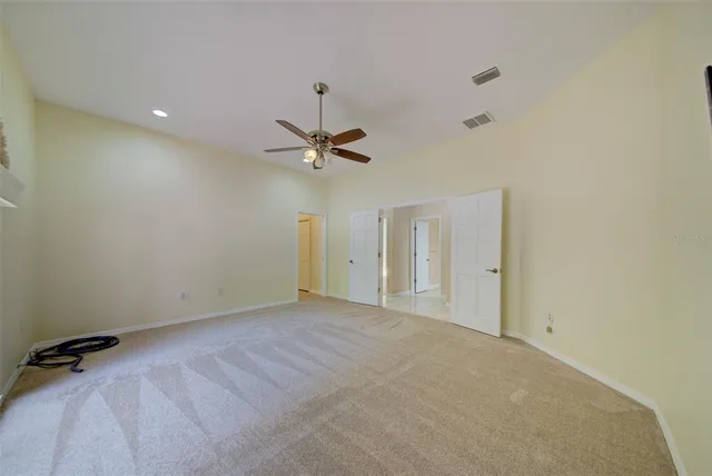 a view of a lake with a house in the background