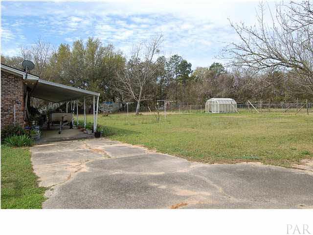 7355 Beulah Road Pensacola, FL 32526 - Photo 12 of 13 Covered patio and boat storage