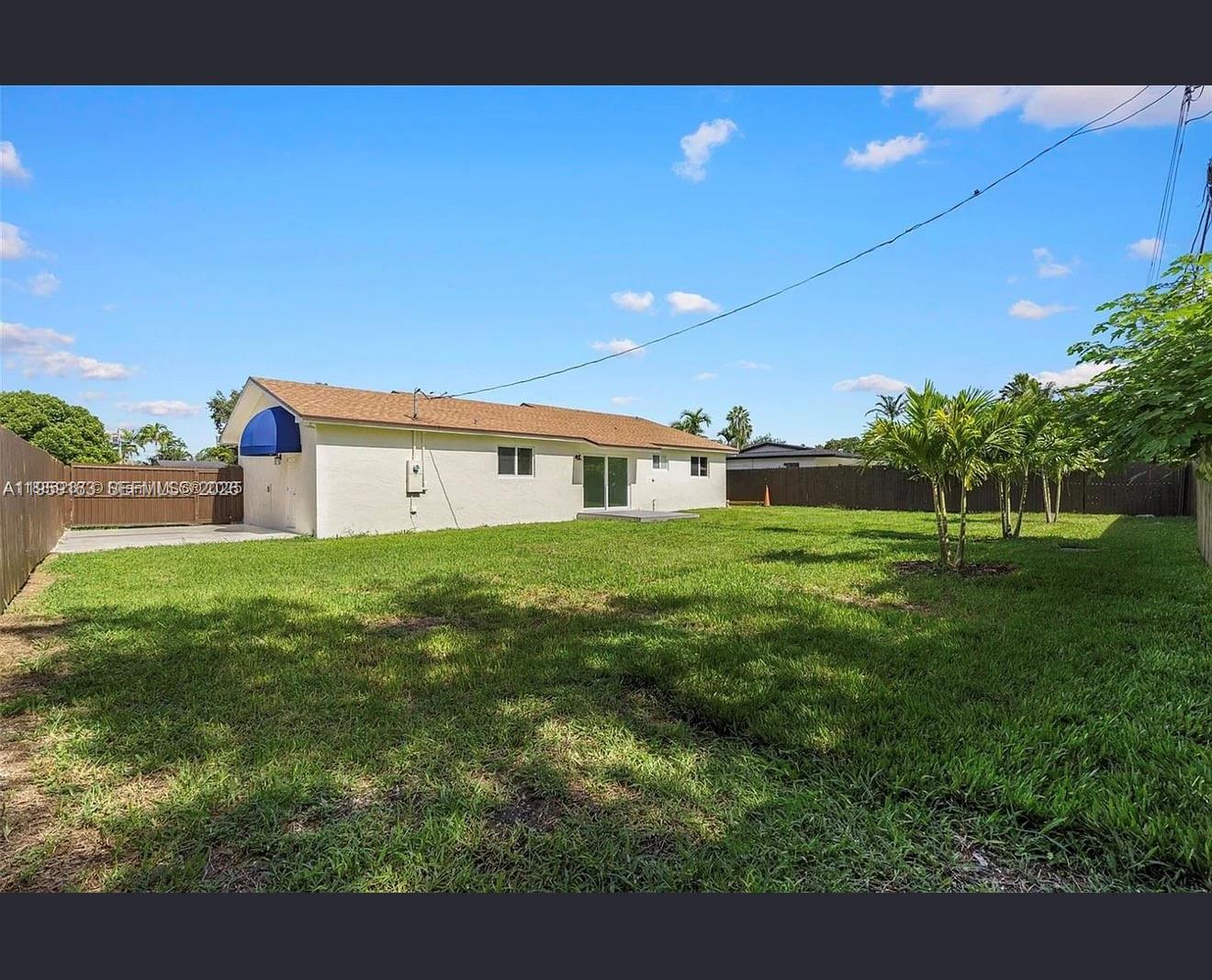 19221 Southwest 92nd Road Cutler Bay, FL 33157 - Photo 4 of 30 a front view of a house with a yard