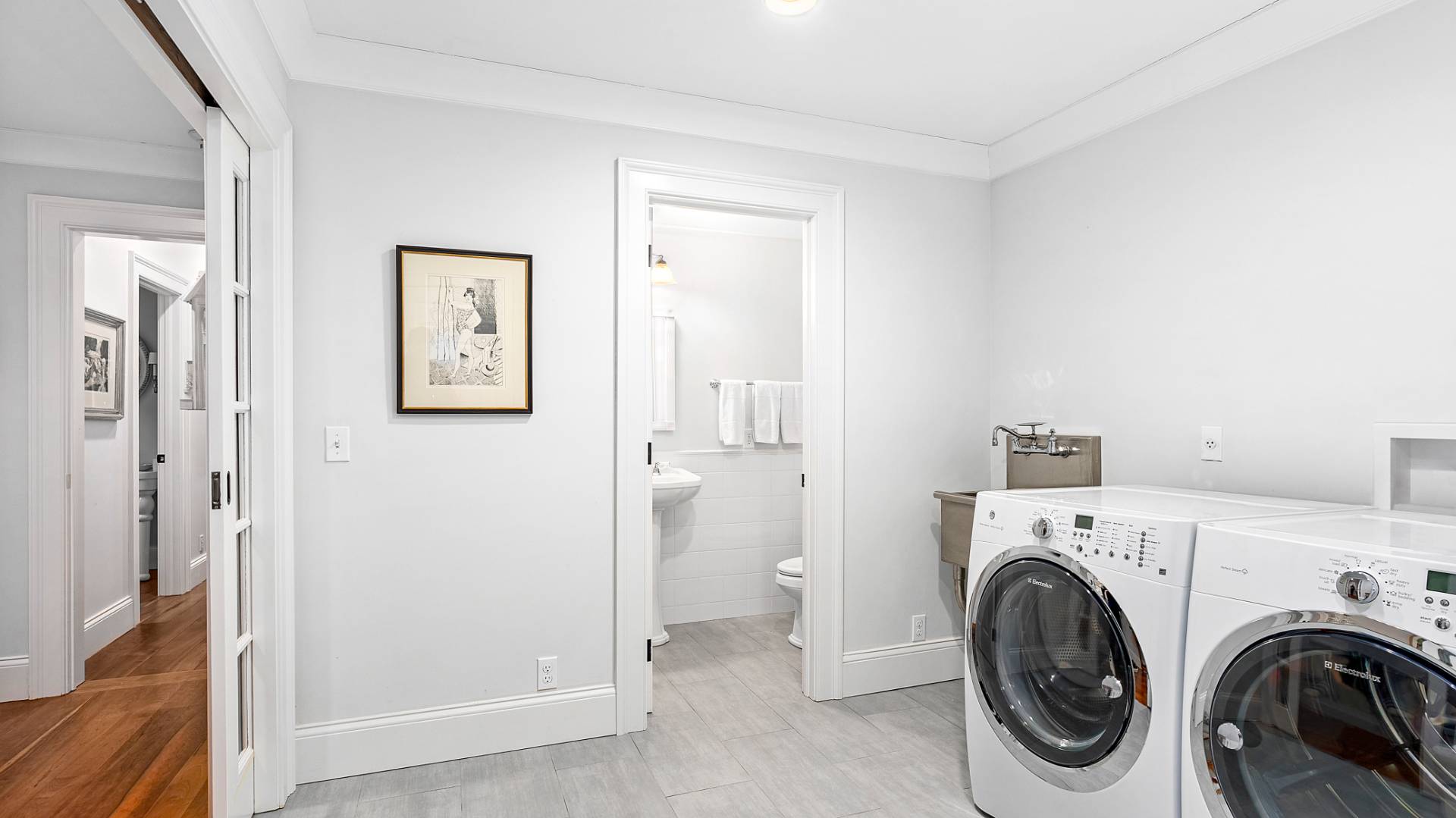 43 Thanet Way East Hampton, NY 11937 - Photo 17 of 34 a view of a hallway with washer and dryer