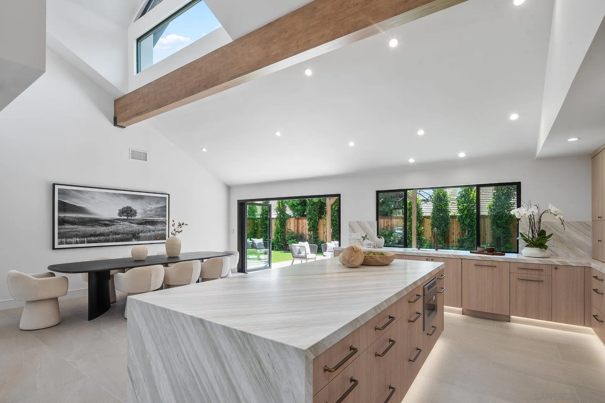 3835 Via Reposo Rancho Santa Fe, CA 92091 - Photo 11 of 34 a large kitchen with stainless steel appliances a large window in it