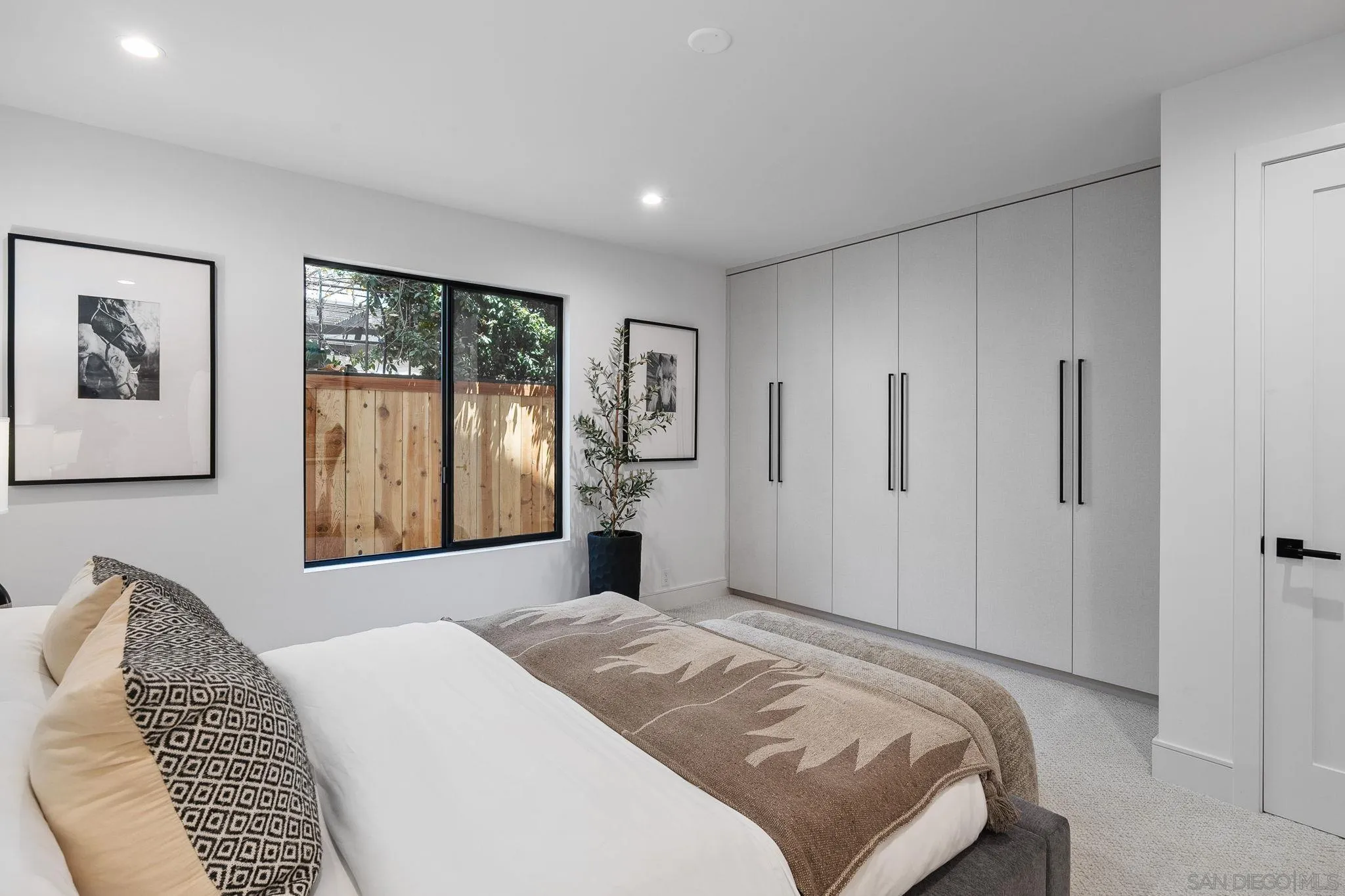 3835 Via Reposo Rancho Santa Fe, CA 92091 - Photo 25 of 34 a bedroom with a large bed and a window