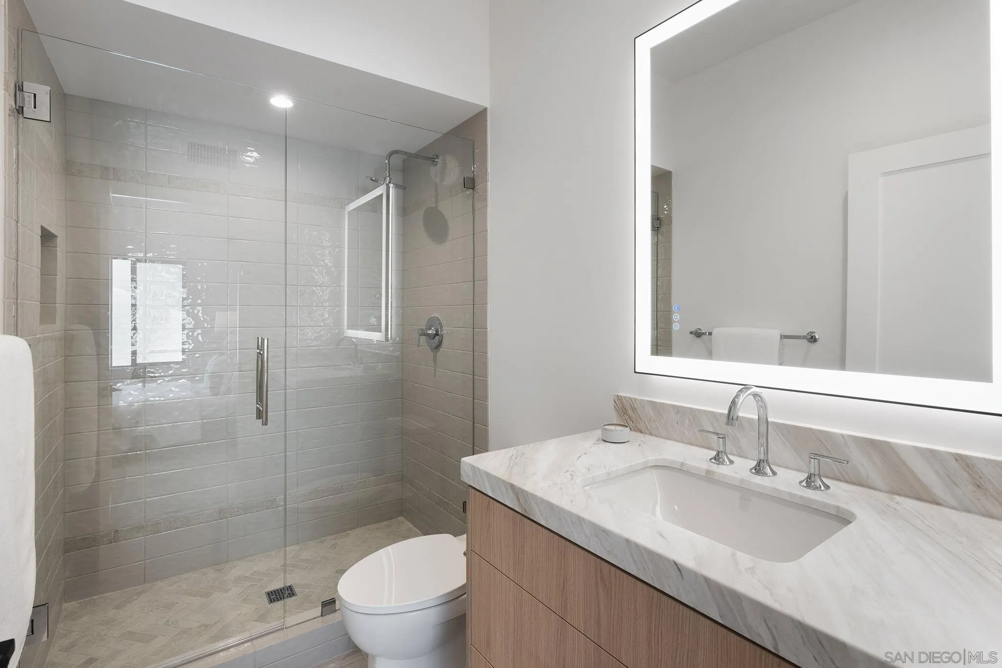 3835 Via Reposo Rancho Santa Fe, CA 92091 - Photo 26 of 34 a bathroom with a granite countertop sink a toilet and shower