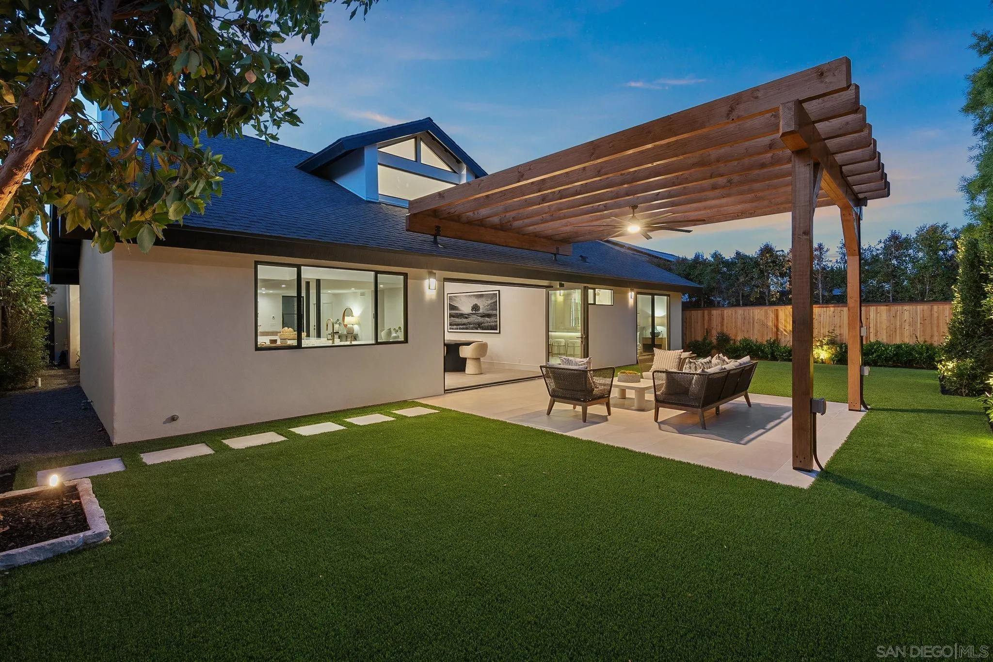 3835 Via Reposo Rancho Santa Fe, CA 92091 - Photo 30 of 34 a view of a backyard with table and chairs under an umbrella