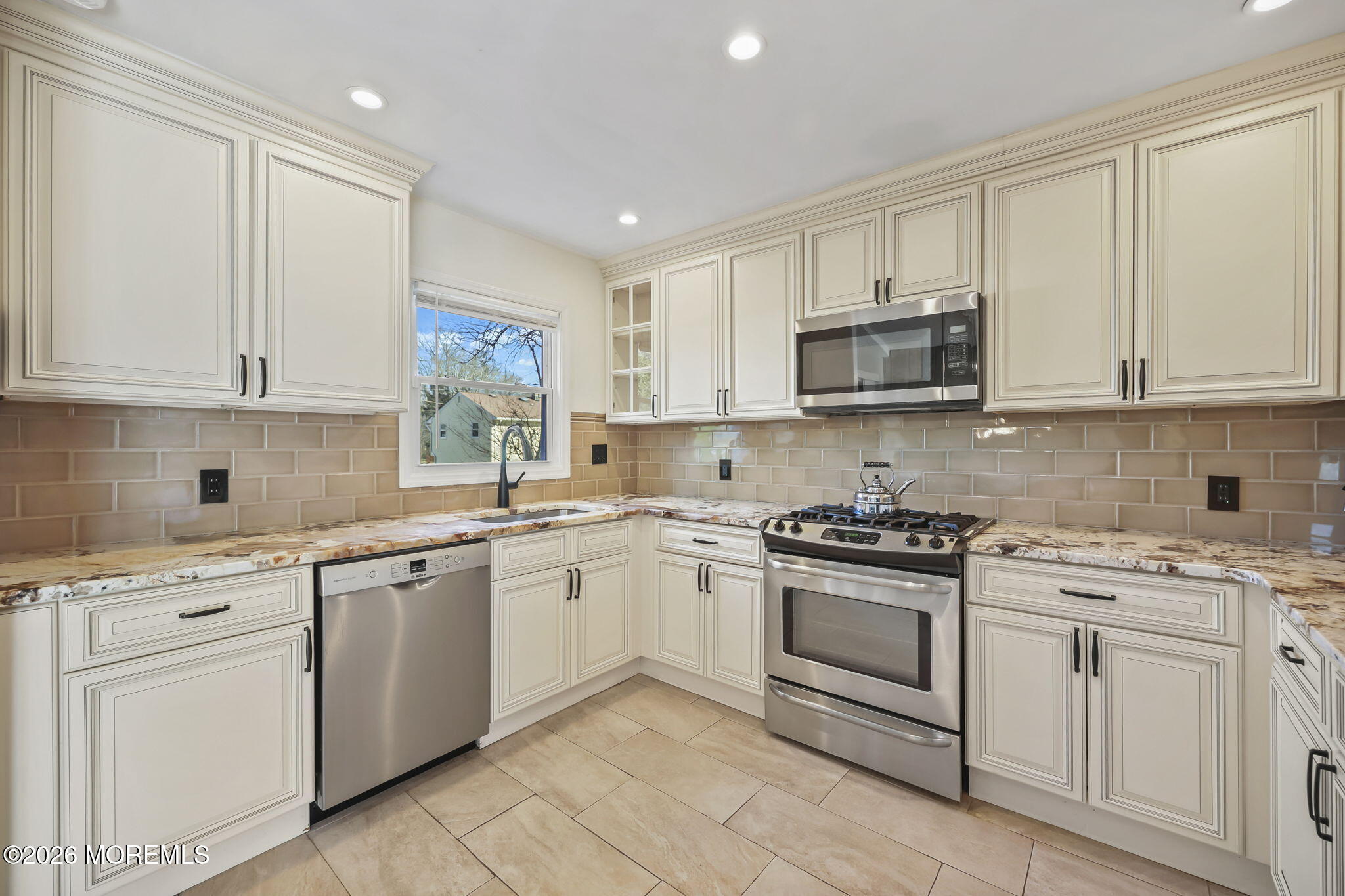 117 Durand Road Neptune Township, NJ 07753 - Photo 11 of 35 a kitchen with white cabinets stainless steel appliances and sink
