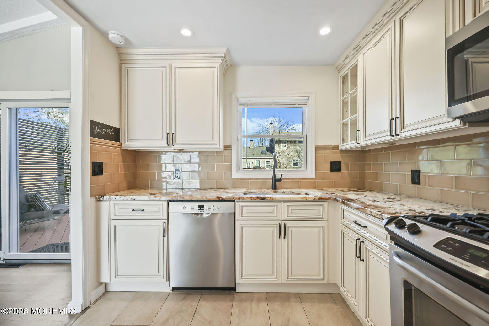 117 Durand Road Neptune Township, NJ 07753 - Photo 13 of 35 a kitchen with white cabinets stainless steel appliances and sink