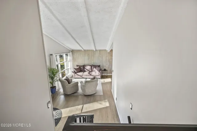 a view of a dining room with furniture and a window