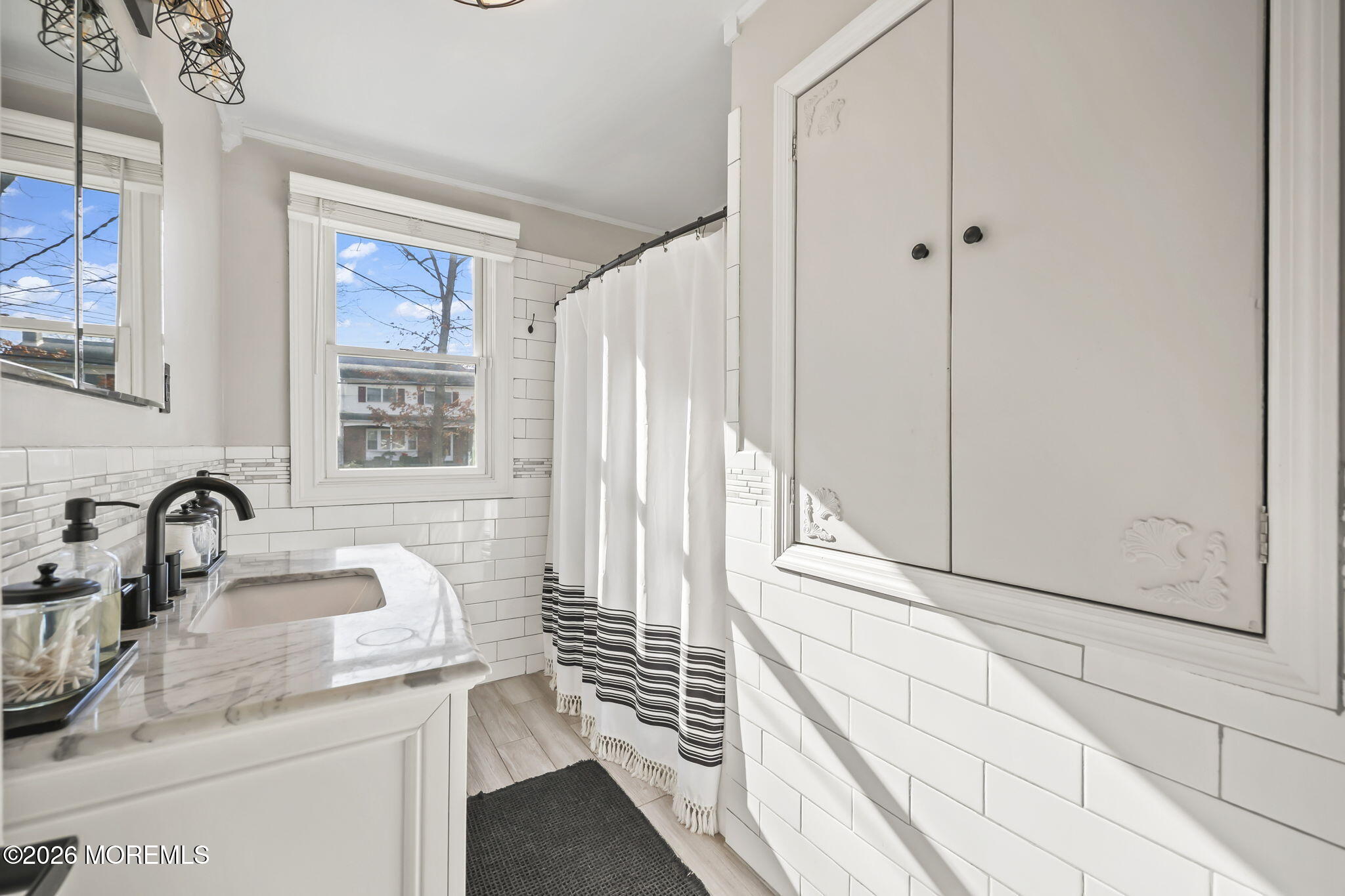 117 Durand Road Neptune Township, NJ 07753 - Photo 16 of 35 a kitchen with granite countertop a sink and a window