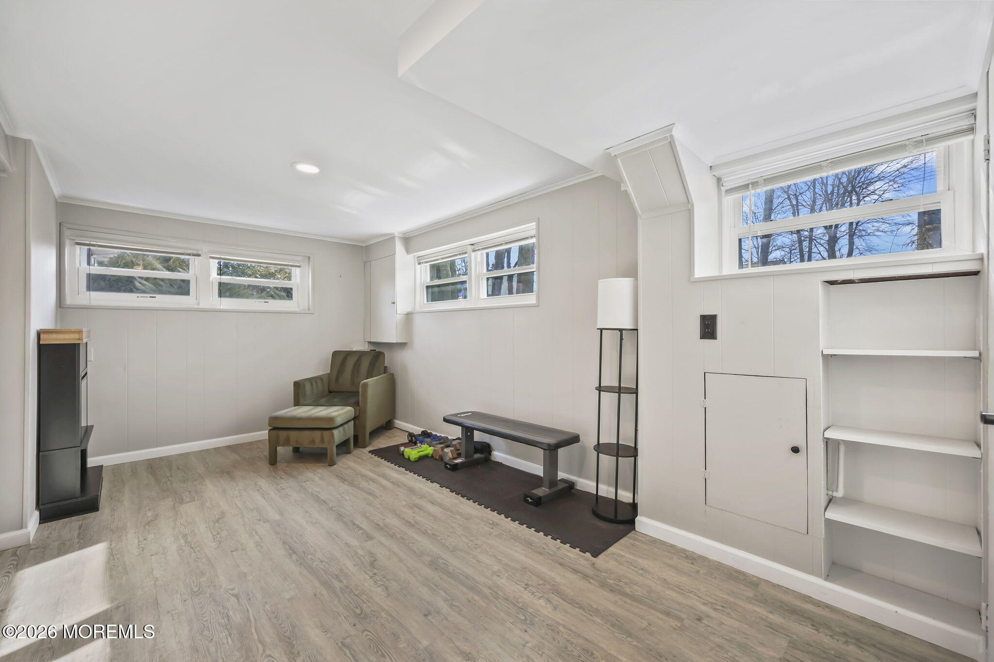 117 Durand Road Neptune Township, NJ 07753 - Photo 21 of 35 a living room with furniture gym equipment and a window