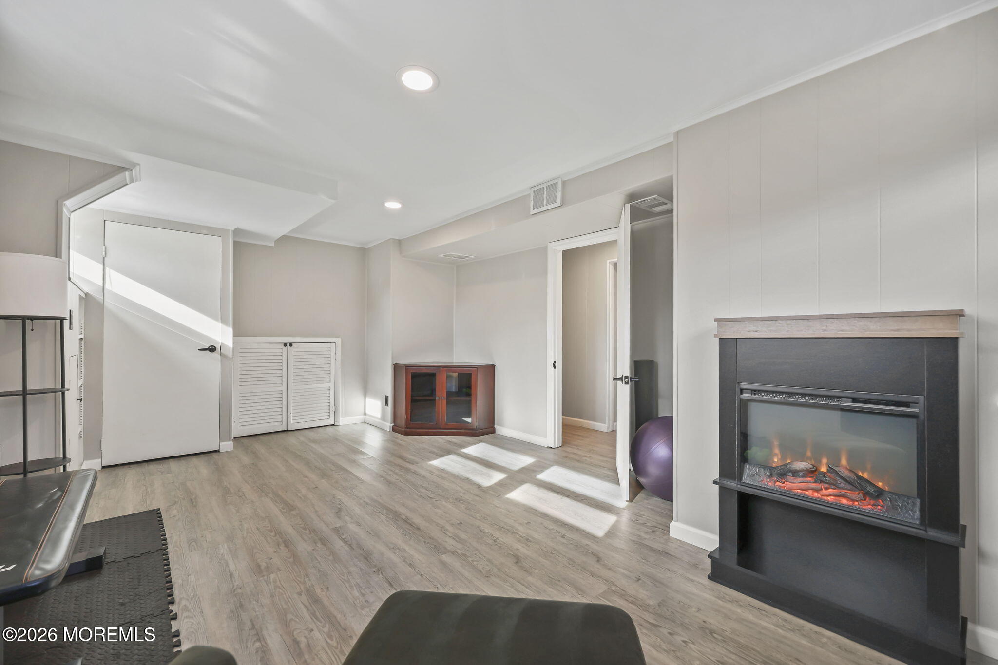 117 Durand Road Neptune Township, NJ 07753 - Photo 22 of 35 a living room with furniture and a fireplace