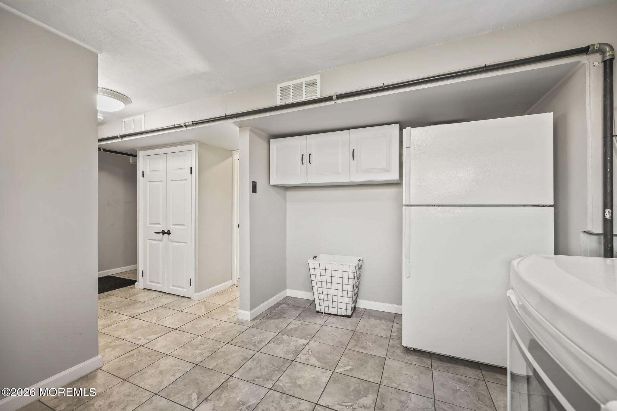 117 Durand Road Neptune Township, NJ 07753 - Photo 27 of 35 a view of kitchen with refrigerator and cabinet