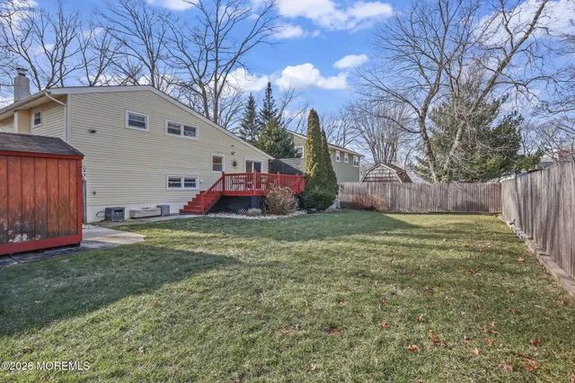a backyard of a house with lots of green space