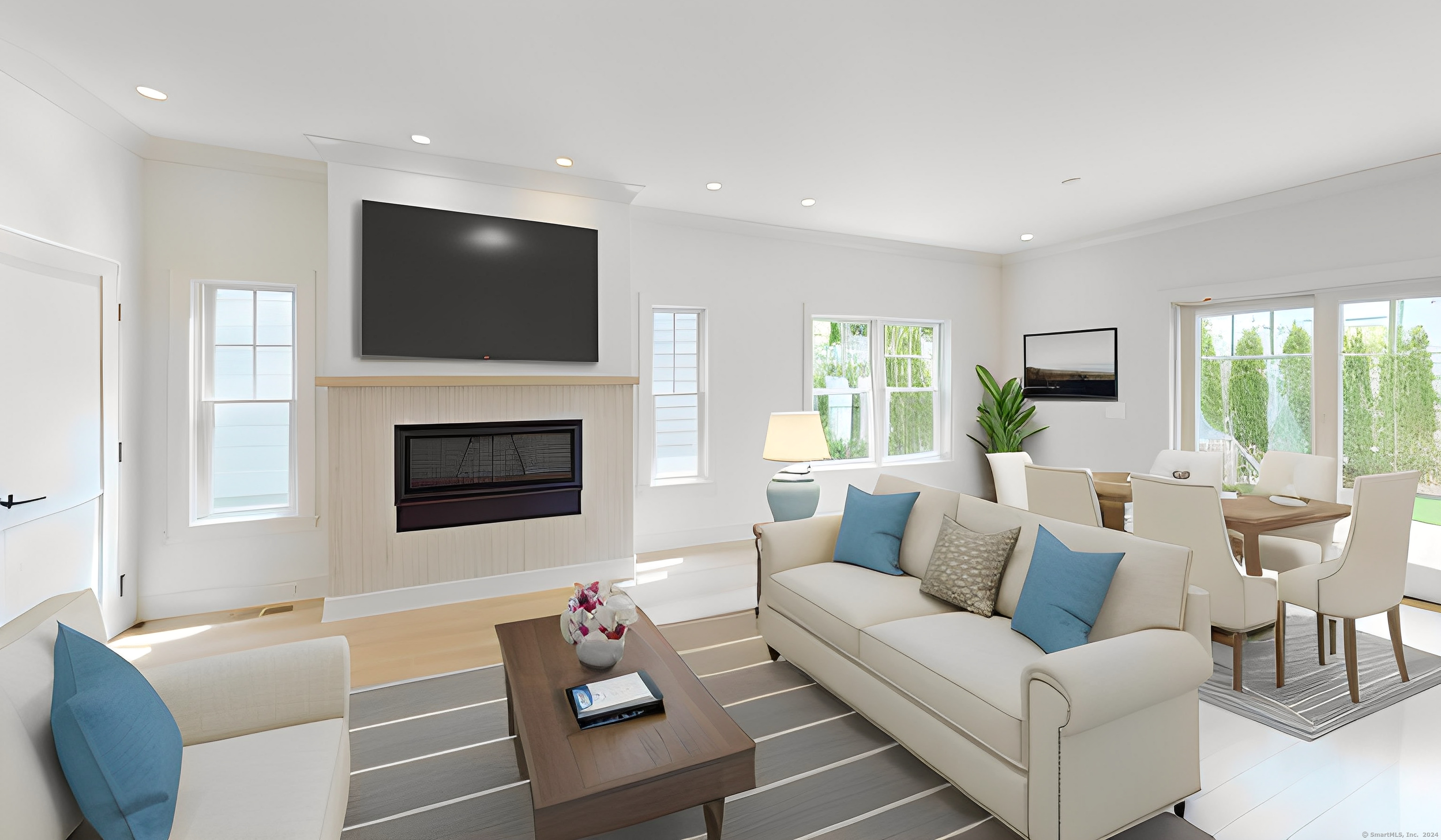 14 William Street West, Unit B Greenwich, CT 06830 - Photo 1 of 1 a living room with furniture a flat screen tv and a fireplace