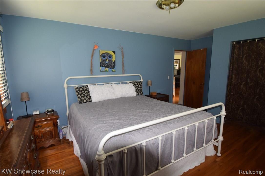 17350 Fish Lake Road Holly, MI 48442 - Photo 18 of 30 Master bedroom large enough for a king sized bed and furniture. Hardwood flooring!