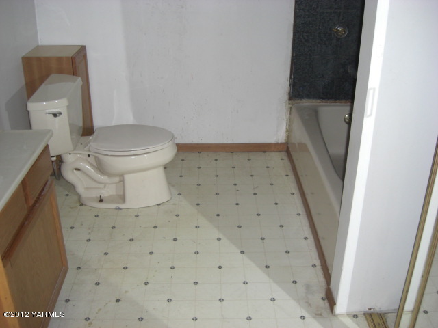 10703 Hughes Road Yakima, WA 98903 - Photo 3 of 8 a bathroom with a sink and a toilet