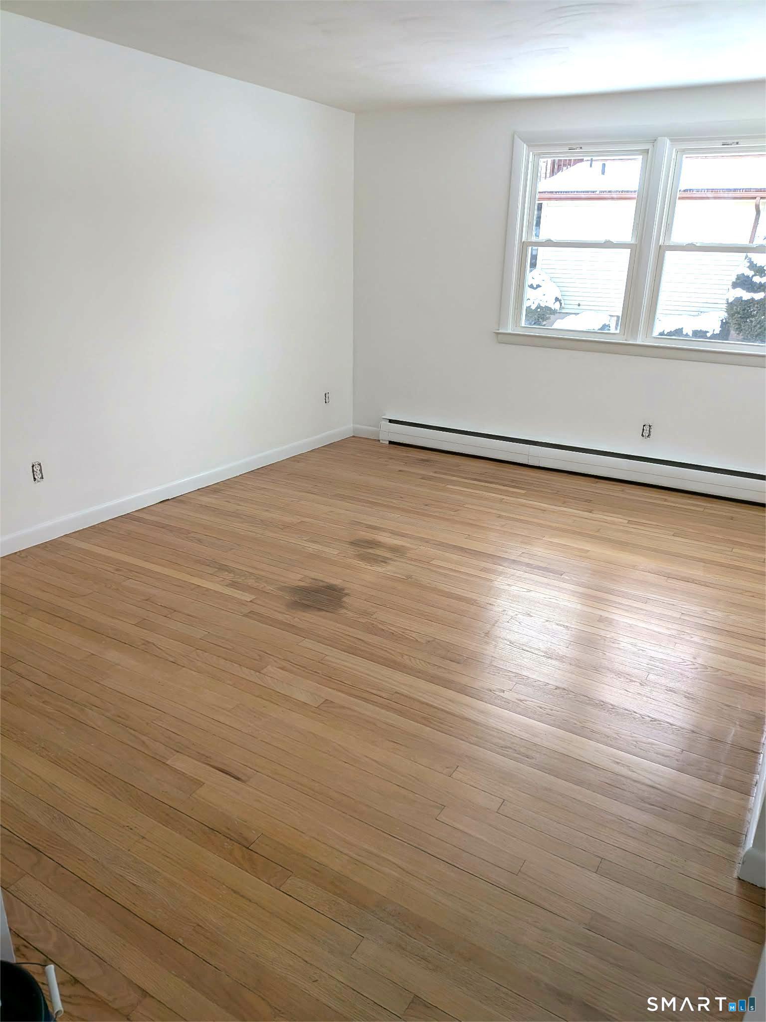 20 Liberty Street Vernon, CT 06066 - Photo 8 of 18 wooden floor in an empty room with a window