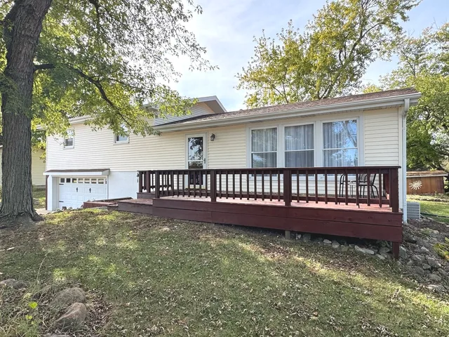 a view of a house with a yard from a balcony
