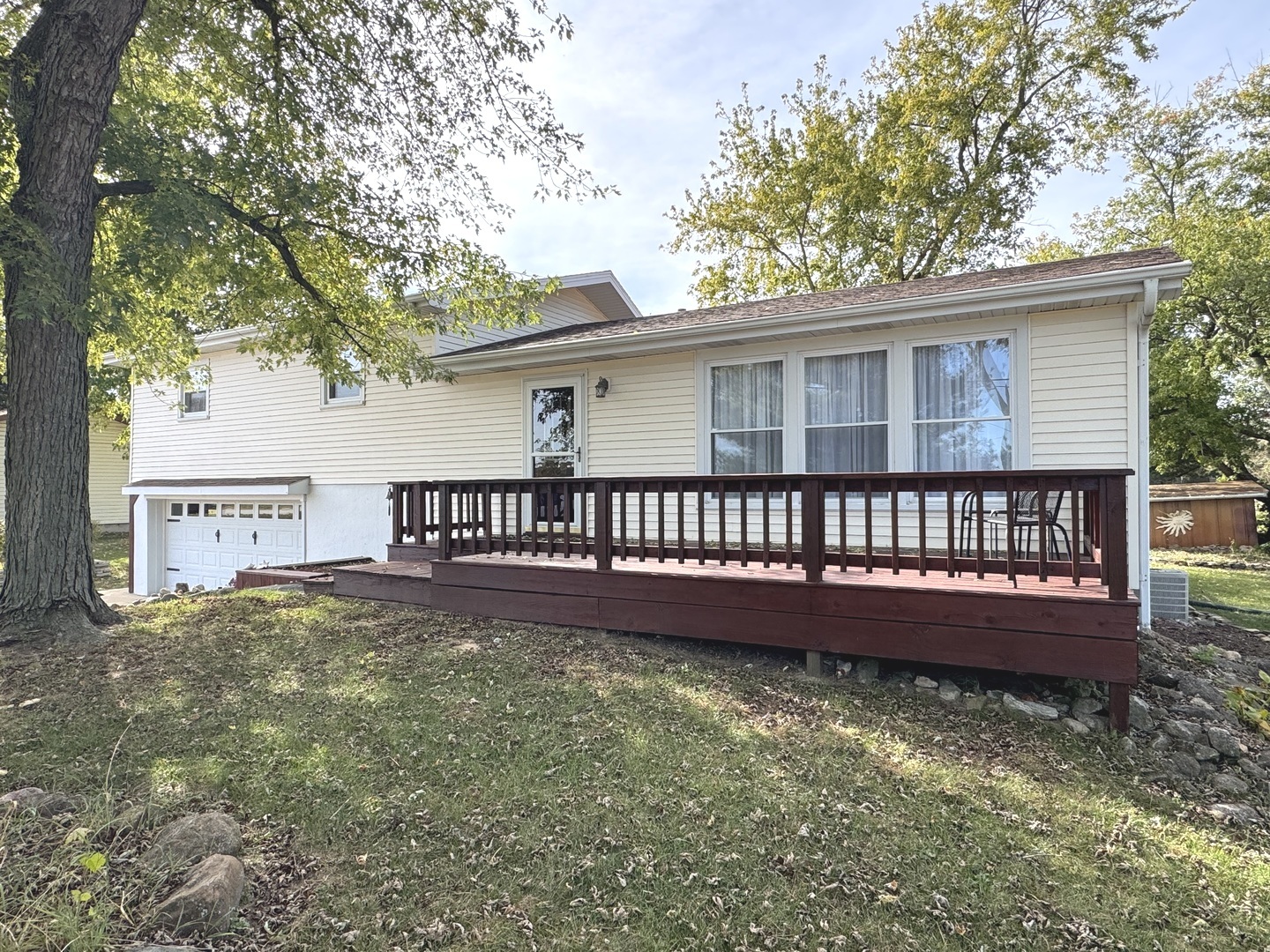 a view of a house with a yard from a balcony