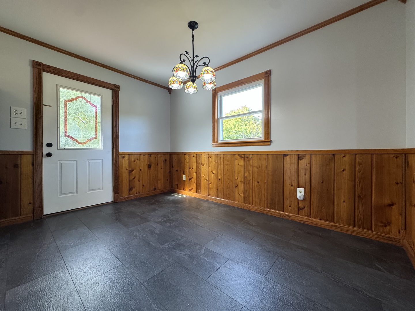 3288 South Hieland Road St. Anne, IL 60964 - Photo 14 of 45 a view of an empty room with wooden floor and a window