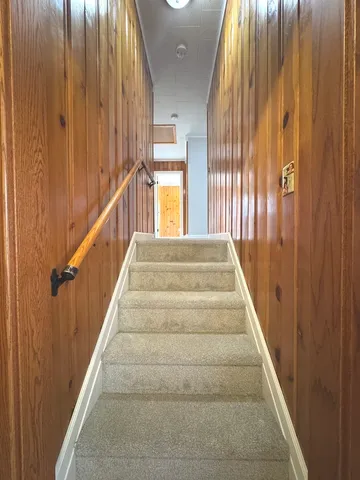 a view of staircase with large window