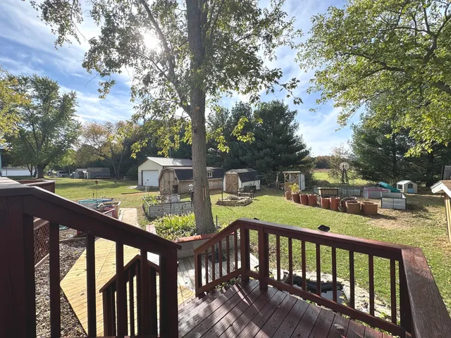 a view of a balcony with two chairs and a table