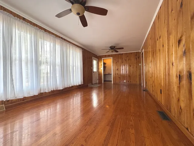 a view of entryway with wooden floor